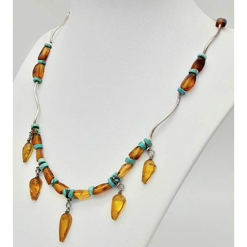 850 - An unique 925 silver Turquoise and Amber colour bead necklace. Total weight 11G. Total length 44cm.