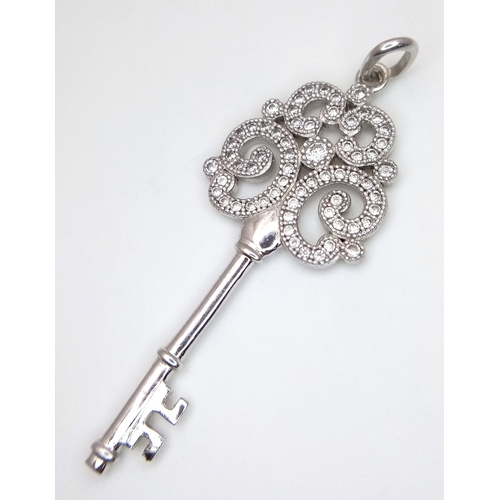 905 - A stunning 925 silver stone set large key pendant. Total weight 3.4G. 5.4cm drop.