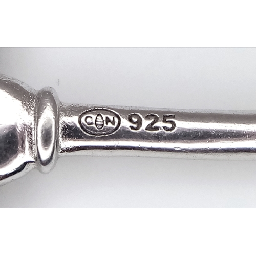 905 - A stunning 925 silver stone set large key pendant. Total weight 3.4G. 5.4cm drop.