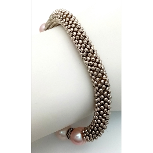 913 - A Pearl and stone set adjustable bracelet. Please see photos for details.