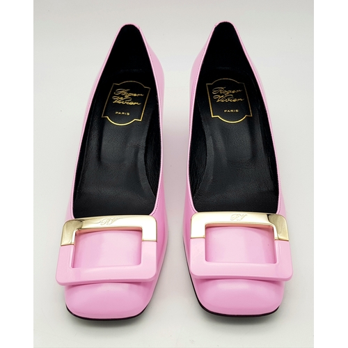 896 - A pair of Roger Vivier Belle Vivier Patent Leather Pumps in pink, featuring gold-tone buckle accents... 