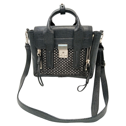 924 - A Phillip Lim black woven straw and leather medium Pashli Satchel. Silver hardware and front flap. T... 