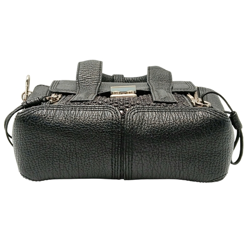 924 - A Phillip Lim black woven straw and leather medium Pashli Satchel. Silver hardware and front flap. T... 