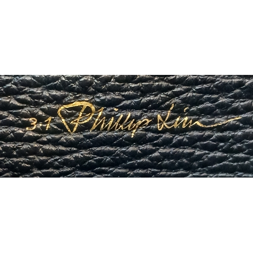 924 - A Phillip Lim black woven straw and leather medium Pashli Satchel. Silver hardware and front flap. T... 