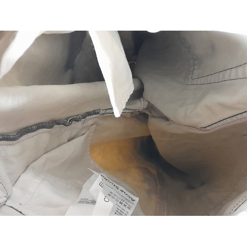 727 - A pair of Acne Studios beige washed denim jeans featuring a high rise waist and classic five-pocket ... 