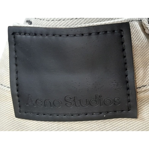 727 - A pair of Acne Studios beige washed denim jeans featuring a high rise waist and classic five-pocket ... 