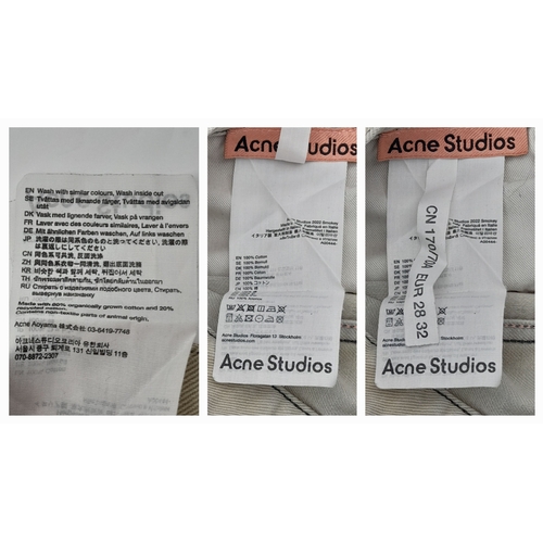 727 - A pair of Acne Studios beige washed denim jeans featuring a high rise waist and classic five-pocket ... 