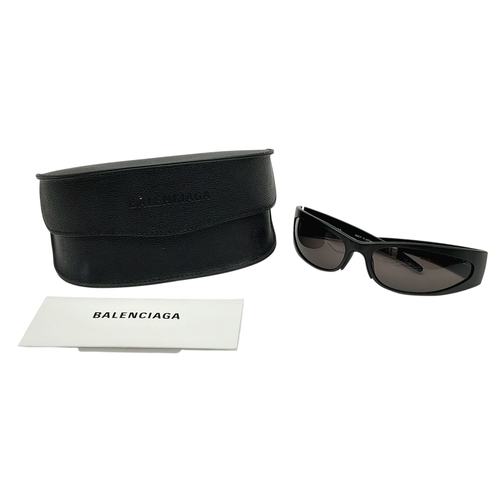 776 - A pair of Balenciaga black aluminium women's sunglasses. Total length 17cm. Comes with original case... 