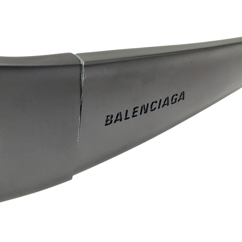 776 - A pair of Balenciaga black aluminium women's sunglasses. Total length 17cm. Comes with original case... 