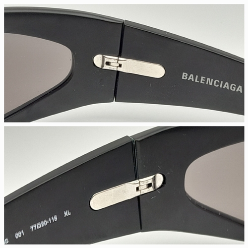 776 - A pair of Balenciaga black aluminium women's sunglasses. Total length 17cm. Comes with original case... 