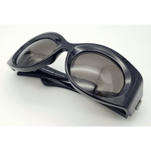 945 - A Pair of Balenciaga black metal sunglasses. Total length 16.5cm. Unworn, excellent condition. Ref J... 