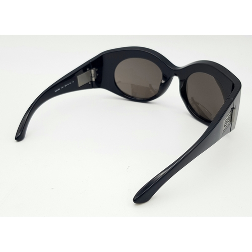 945 - A Pair of Balenciaga black metal sunglasses. Total length 16.5cm. Unworn, excellent condition. Ref J... 