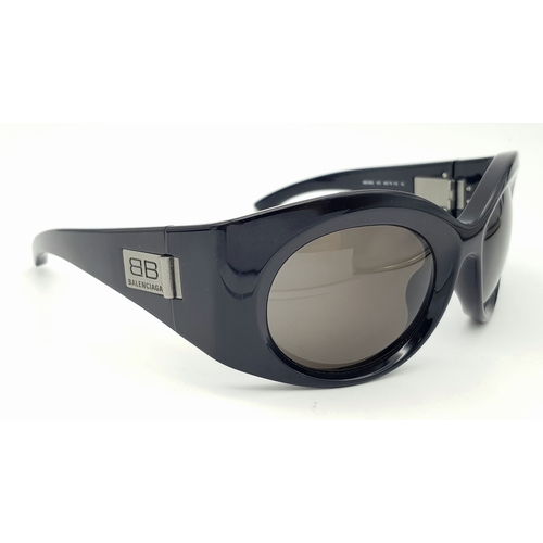 945 - A Pair of Balenciaga black metal sunglasses. Total length 16.5cm. Unworn, excellent condition. Ref J... 