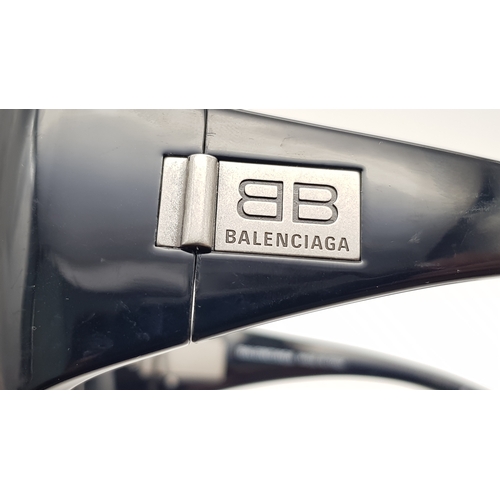 945 - A Pair of Balenciaga black metal sunglasses. Total length 16.5cm. Unworn, excellent condition. Ref J... 