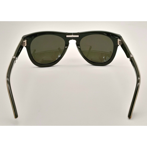 952 - A pair of Valentino Camouflage foldable sunglasses. Total length 15cm. Comes with COA and original c... 