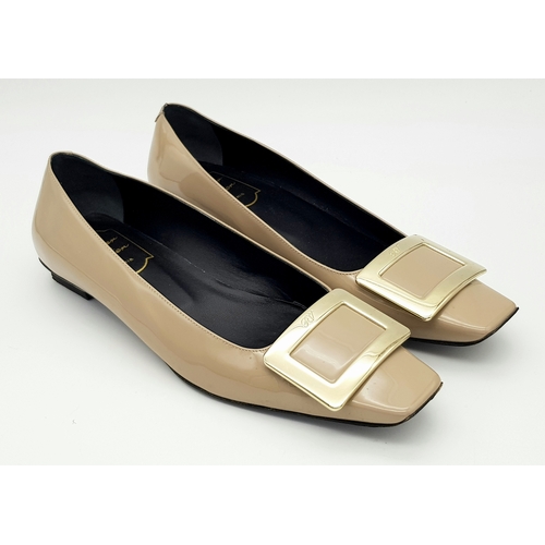 769 - A pair of Roger Vivier Belle Vivier patent leather pumps. Features a signature square toe with a lar... 