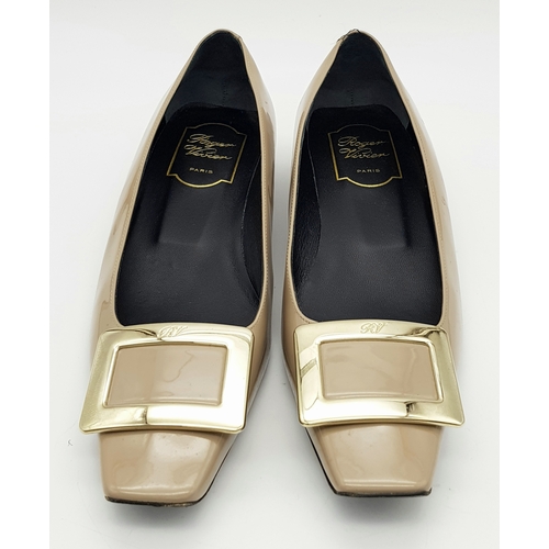 769 - A pair of Roger Vivier Belle Vivier patent leather pumps. Features a signature square toe with a lar... 
