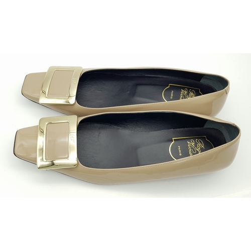 769 - A pair of Roger Vivier Belle Vivier patent leather pumps. Features a signature square toe with a lar... 
