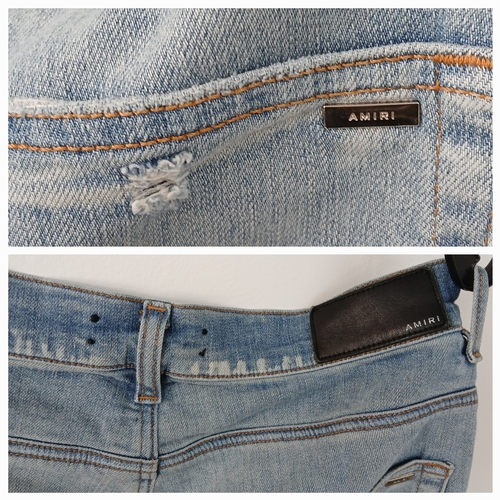 959 - A pair of Amiri light wash distressed skinny jeans featuring heavy ripped details throughout the leg... 