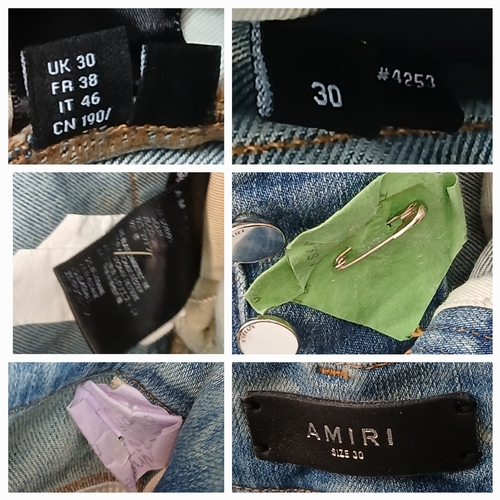 959 - A pair of Amiri light wash distressed skinny jeans featuring heavy ripped details throughout the leg... 