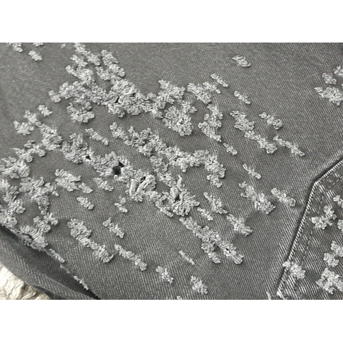 741 - A pair of Acne Studios black denim jeans. Designed with a classic five-pocket layout and zip fly. Eu... 