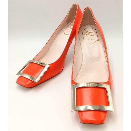636 - A pair of Roger Vivier bold red patent leather Pumps. Features a square toe and oversized metal buck... 