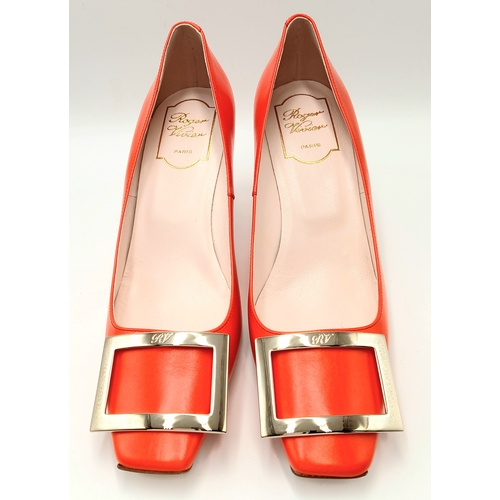 636 - A pair of Roger Vivier bold red patent leather Pumps. Features a square toe and oversized metal buck... 