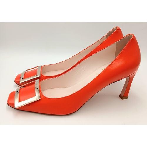 636 - A pair of Roger Vivier bold red patent leather Pumps. Features a square toe and oversized metal buck... 