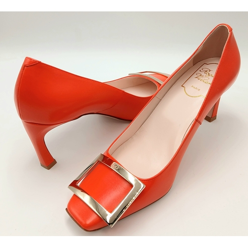 636 - A pair of Roger Vivier bold red patent leather Pumps. Features a square toe and oversized metal buck... 