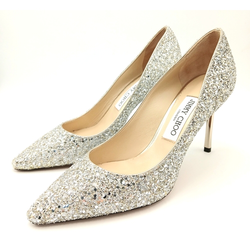 748 - A dazzling pair of Jimmy Choo champange coarse glitter fabric pointed pumps. Size 38/UK size 5. Come... 