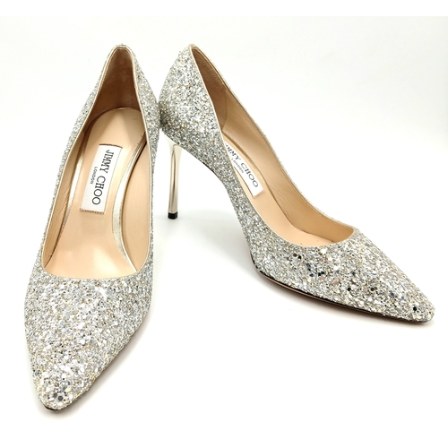 748 - A dazzling pair of Jimmy Choo champange coarse glitter fabric pointed pumps. Size 38/UK size 5. Come... 