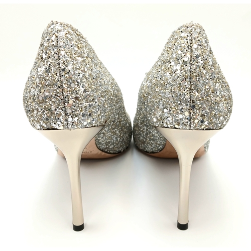 748 - A dazzling pair of Jimmy Choo champange coarse glitter fabric pointed pumps. Size 38/UK size 5. Come... 