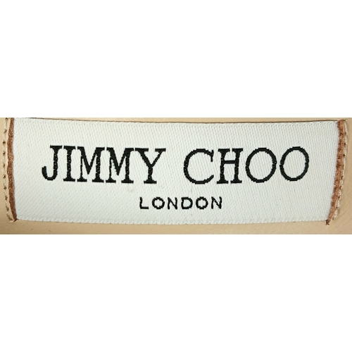 748 - A dazzling pair of Jimmy Choo champange coarse glitter fabric pointed pumps. Size 38/UK size 5. Come... 