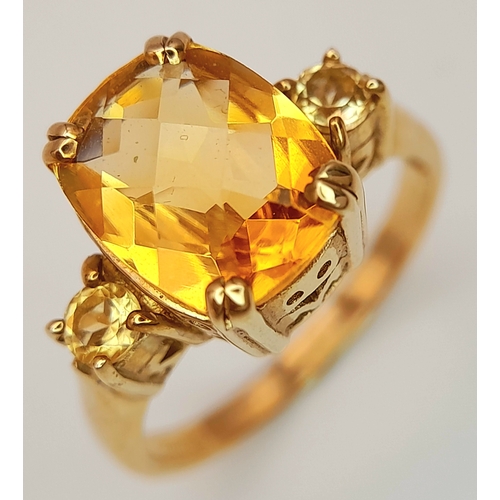 650 - A 9K Yellow Gold Citrine Ring. 2.316ct Antique cut centre stone with small round cut citrine accents... 