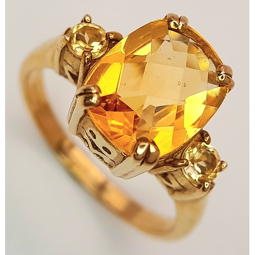 650 - A 9K Yellow Gold Citrine Ring. 2.316ct Antique cut centre stone with small round cut citrine accents... 