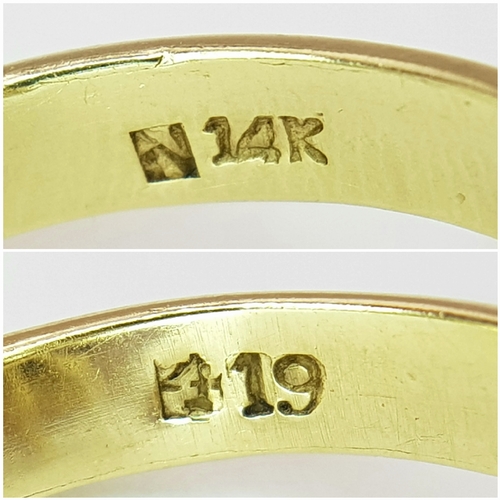 553 - A 14K Yellow Gold Sapphire Burst Ring. Eight black star oval sapphires in surround form of eight sma... 