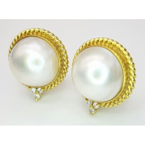 546 - A Pair of 18K Yellow Gold, Mabe Pearl and Diamond Earrings. Beautiful pearl cabochons each with thre... 