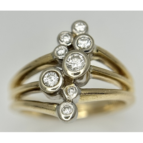 567 - A 14K Yellow Gold, Diamond Starburst Orbital Ring. c. 0.60ctw round brilliant cut diamonds. Size N. ... 