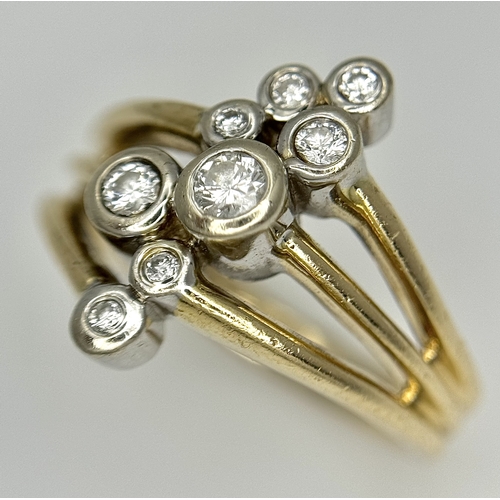 567 - A 14K Yellow Gold, Diamond Starburst Orbital Ring. c. 0.60ctw round brilliant cut diamonds. Size N. ... 