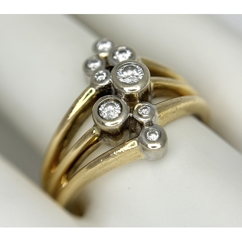 567 - A 14K Yellow Gold, Diamond Starburst Orbital Ring. c. 0.60ctw round brilliant cut diamonds. Size N. ... 