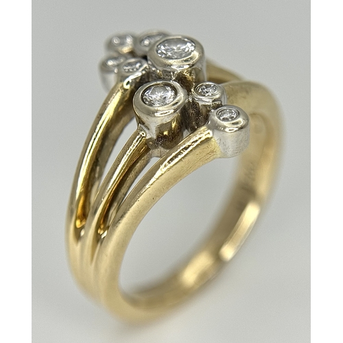 567 - A 14K Yellow Gold, Diamond Starburst Orbital Ring. c. 0.60ctw round brilliant cut diamonds. Size N. ... 