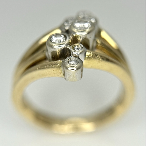 567 - A 14K Yellow Gold, Diamond Starburst Orbital Ring. c. 0.60ctw round brilliant cut diamonds. Size N. ... 