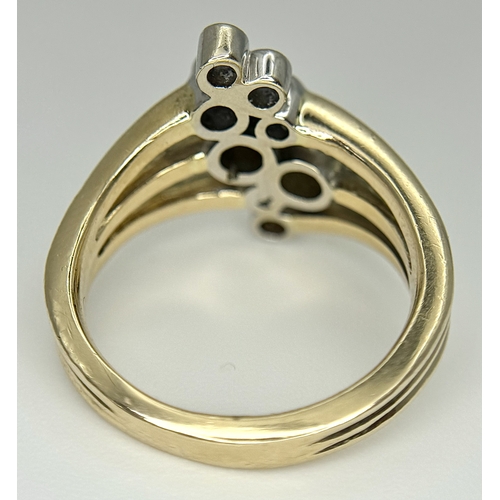 567 - A 14K Yellow Gold, Diamond Starburst Orbital Ring. c. 0.60ctw round brilliant cut diamonds. Size N. ... 