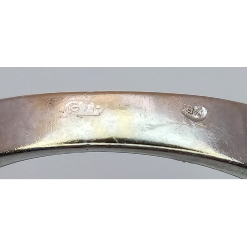 615 - An 18K White Gold (tested) Amethyst and Diamond Ring. A 2.5ct step cut amethyst with a three round b... 