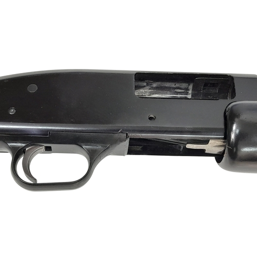 803 - A Mossberg 12 Gauge Pump Action Shotgun. This Model 500A beast dry pumps with a sound that would bri... 