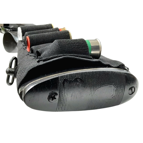 803 - A Mossberg 12 Gauge Pump Action Shotgun. This Model 500A beast dry pumps with a sound that would bri... 