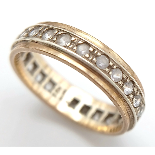 571 - A 9K Gold White Stone Eternity Ring. 2.6g. Size K.
