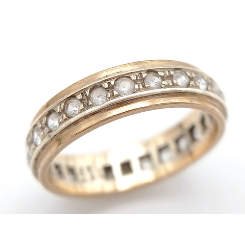 571 - A 9K Gold White Stone Eternity Ring. 2.6g. Size K.