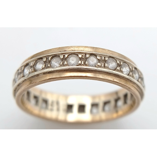 571 - A 9K Gold White Stone Eternity Ring. 2.6g. Size K.