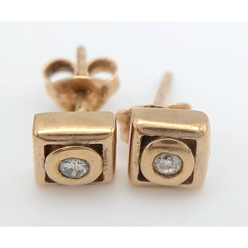 737 - A Pair of 9K Yellow Gold and Diamond Stud Earrings. 1.57g.